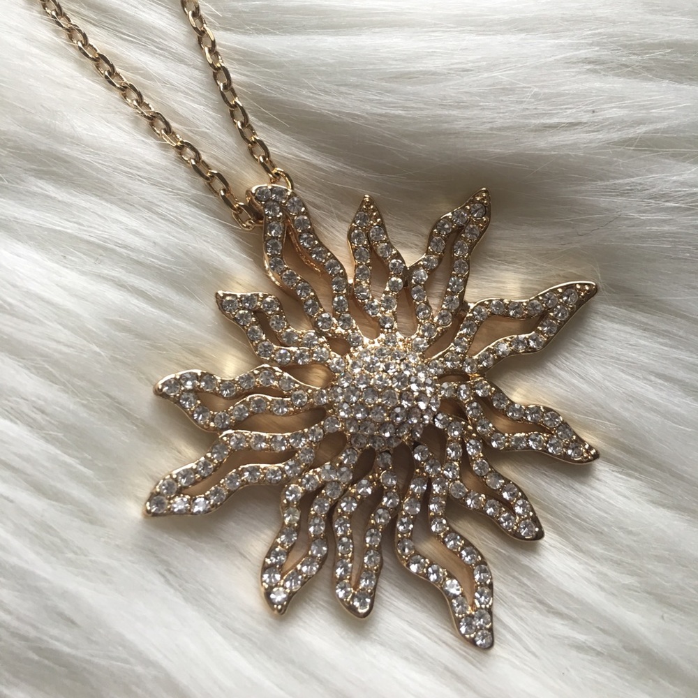 Gold sunburst necklace with clear stunning stones